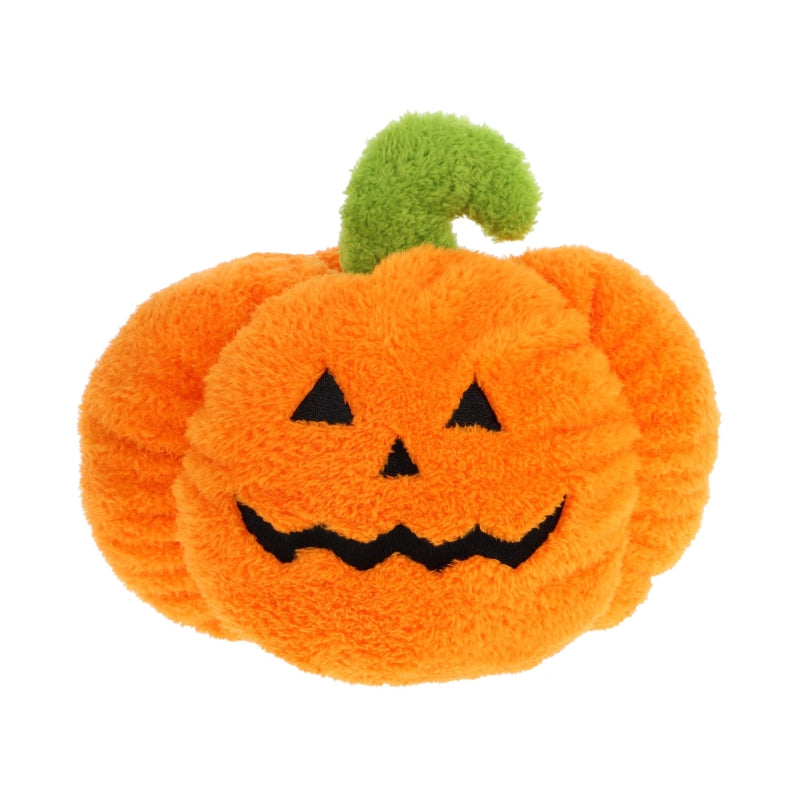 Plush orange pumpkin toy with a smiling face and black eyes on a white background. The pumpkin has a green stalk coming out the top and appears to be in fluffy material.