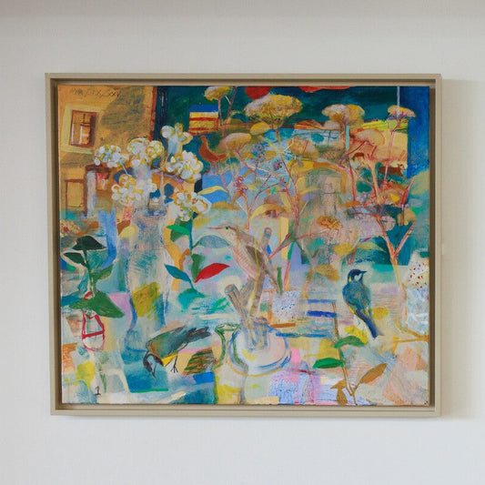 Three colorful abstract paintings on a white wall