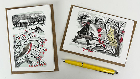 A pack of Christmas notecards designed by print maker Angela Harding. The designs feature wintery birds and the main colours are red, black and white.