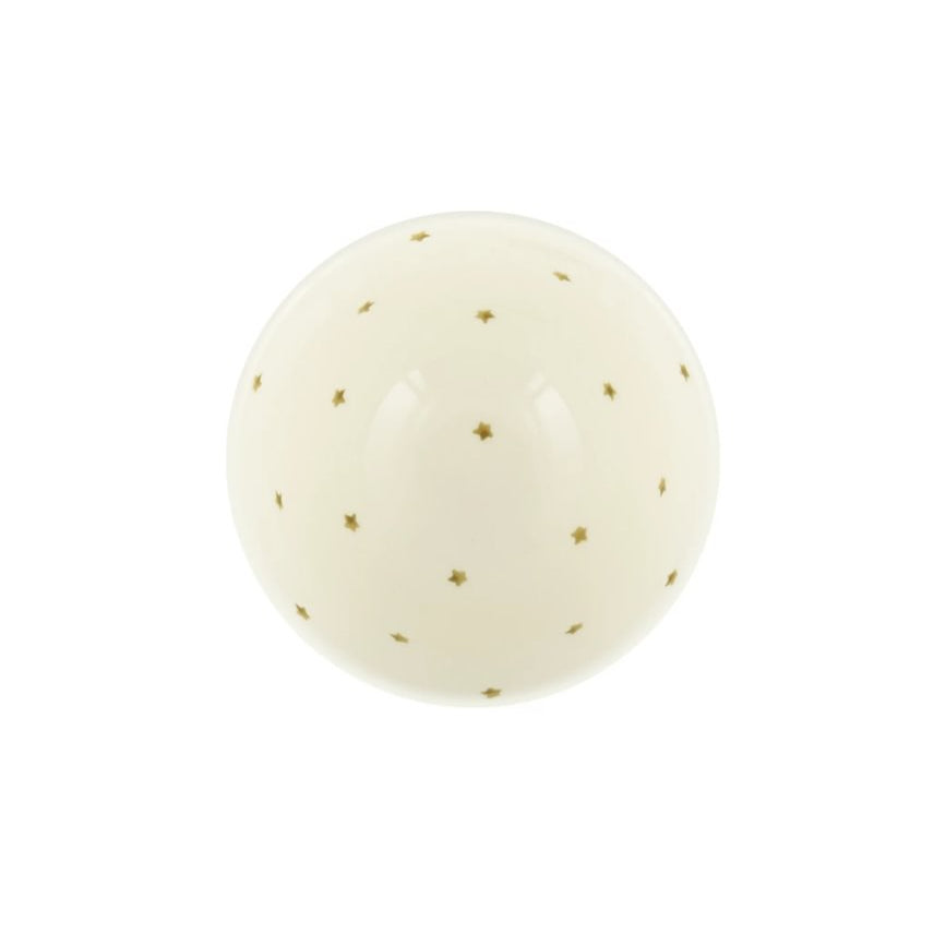 Inside of ceramic white bowl featuring gold stars on a white background.