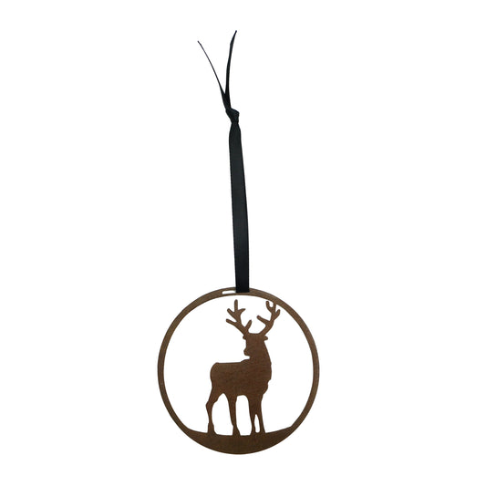 Decorative laser cut round metal ornament with stag silhouette on a plain white background, hanging from a black ribbon.