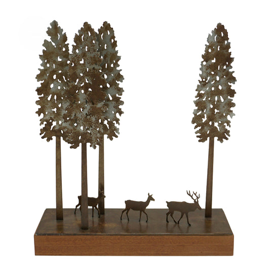 Decorative laser cut metal sculpture of four trees, a stag and two deer on a wooden base.