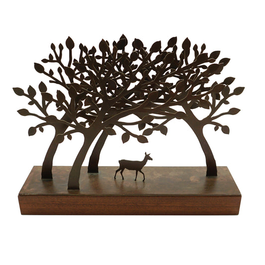 A steel and wood mini sculpture featuring laser cut trees that form a tunnel where a single deer sits in the middle.