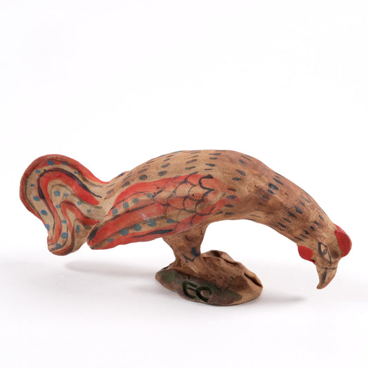 Ceramic rooster painted whistle with red accents on a white background