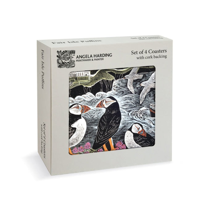 A boxed set of four coasters by Angela Harding, featuring a printed illustration of puffins, seals, and waves on the front window. The box is light gray with black text and the artist's name visible on the side.