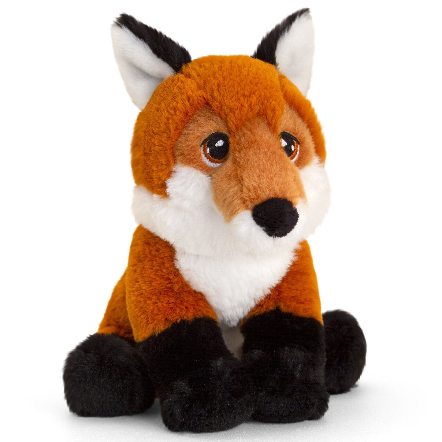 A soft, plush toy fox with a vibrant orange coat, white underbelly, and black accents on its ears and paws. It has large, expressive brown eyes and a friendly expression, sitting upright with its front paws tucked beneath its body.