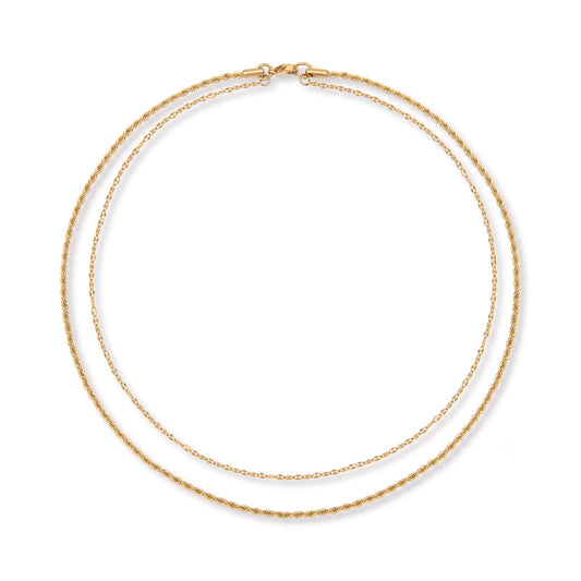 Two gold chains layered on top of each other joined into one necklace at the top on a white background.