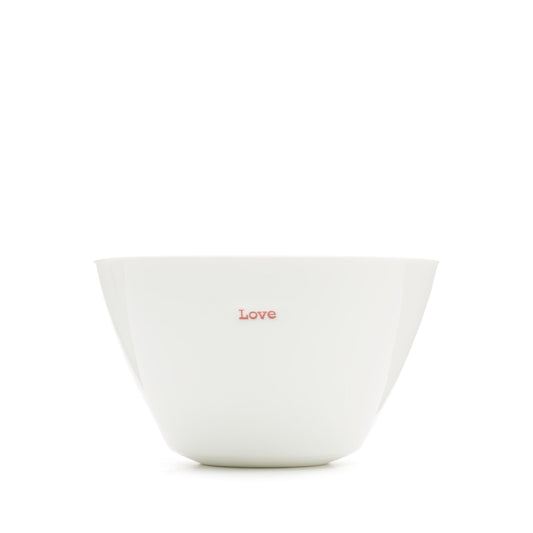A white porcelain bowl with the word 'Love' stamped in red typewriter font on the front.