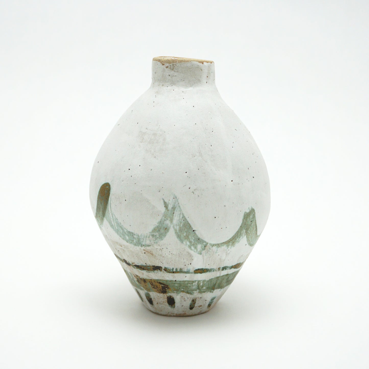 White ceramic oval vase with green and brown glazed accents on a white background. The green and brown glaze is painted on in swooping lines.