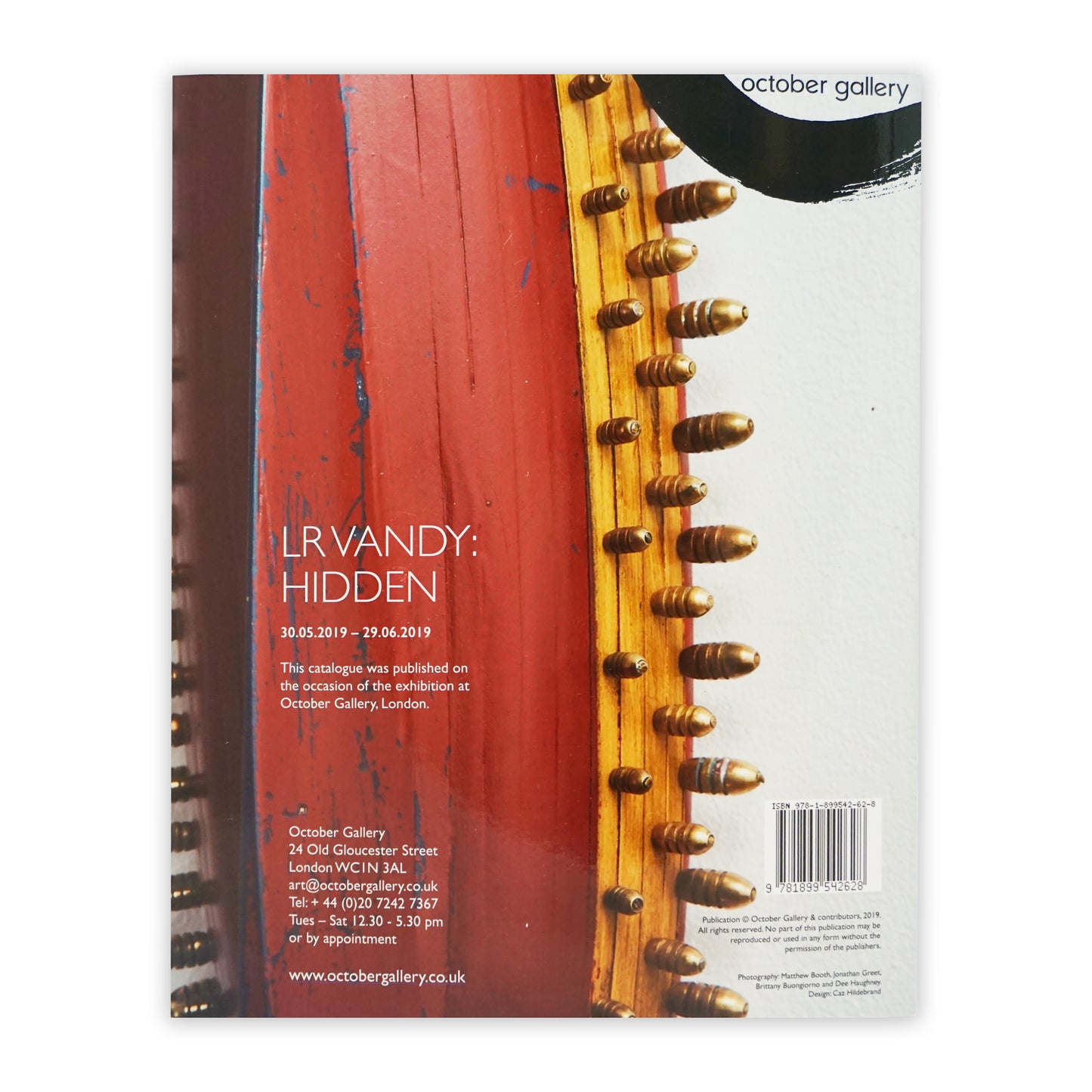 Book back cover with text about October Gallery exhibition.