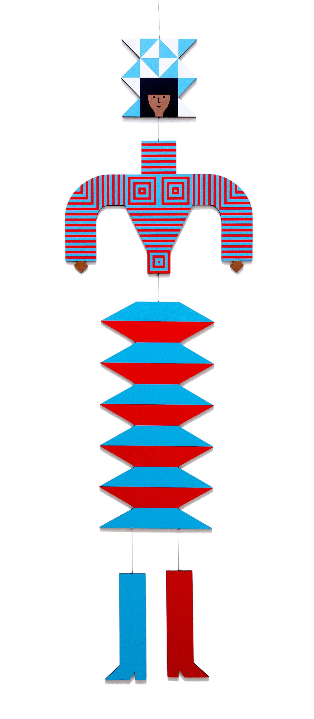 A hanging wooden colourful mobile featuring a full figure with a headdress and boots covered in bright geometric patterns.