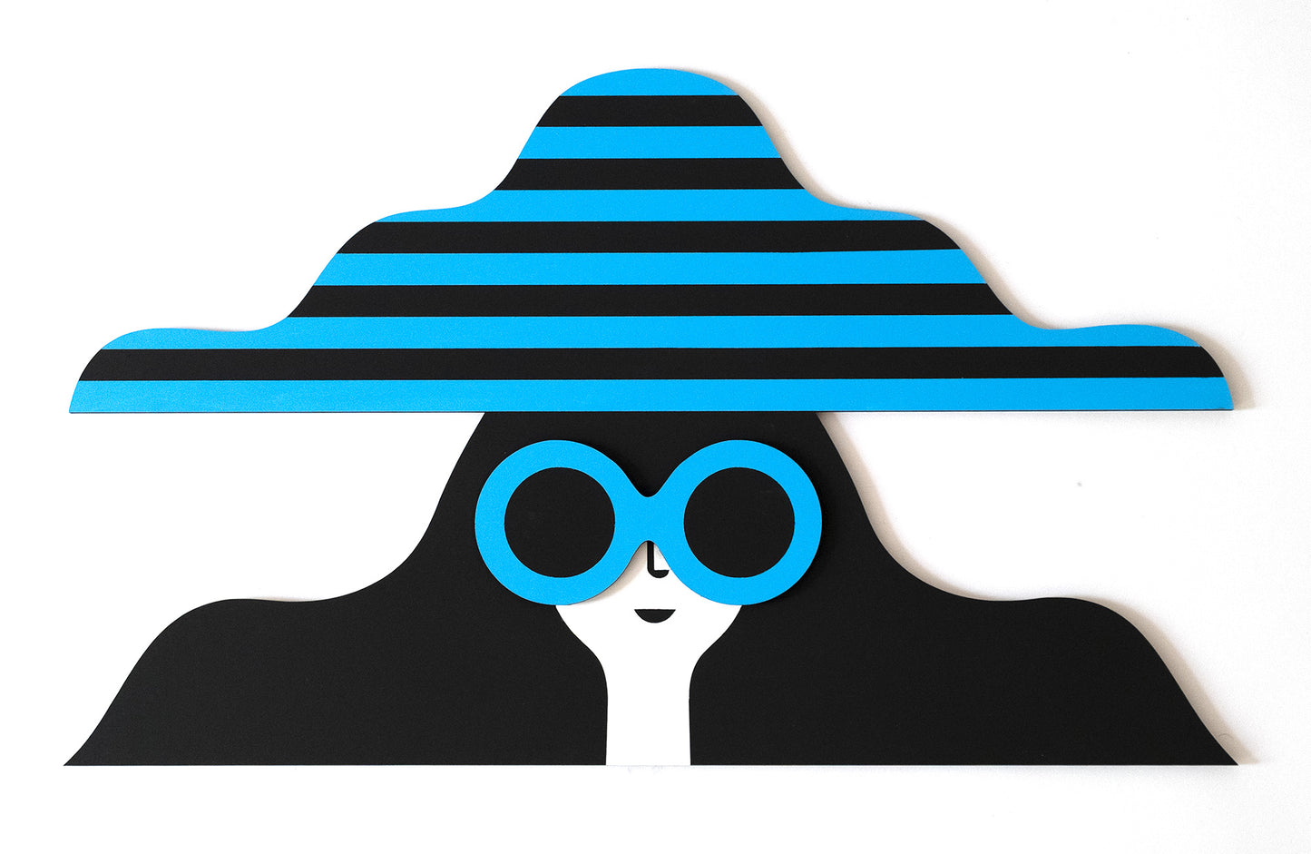 A wooden painted face featuring a stripey blue and black hat and a pair of blue sunglasses with long black hair.