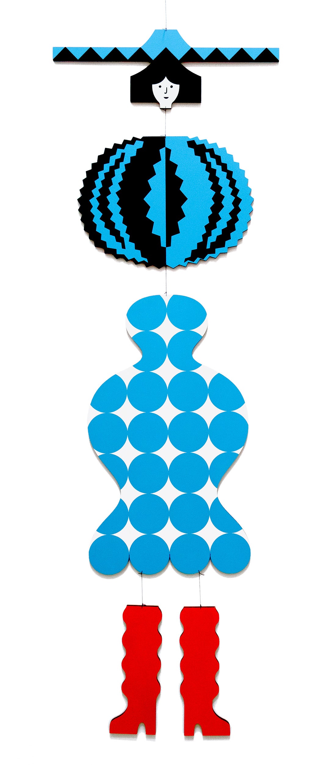 A hanging wooden colourful mobile featuring a full figure with a headdress and boots covered in bright geometric patterns.