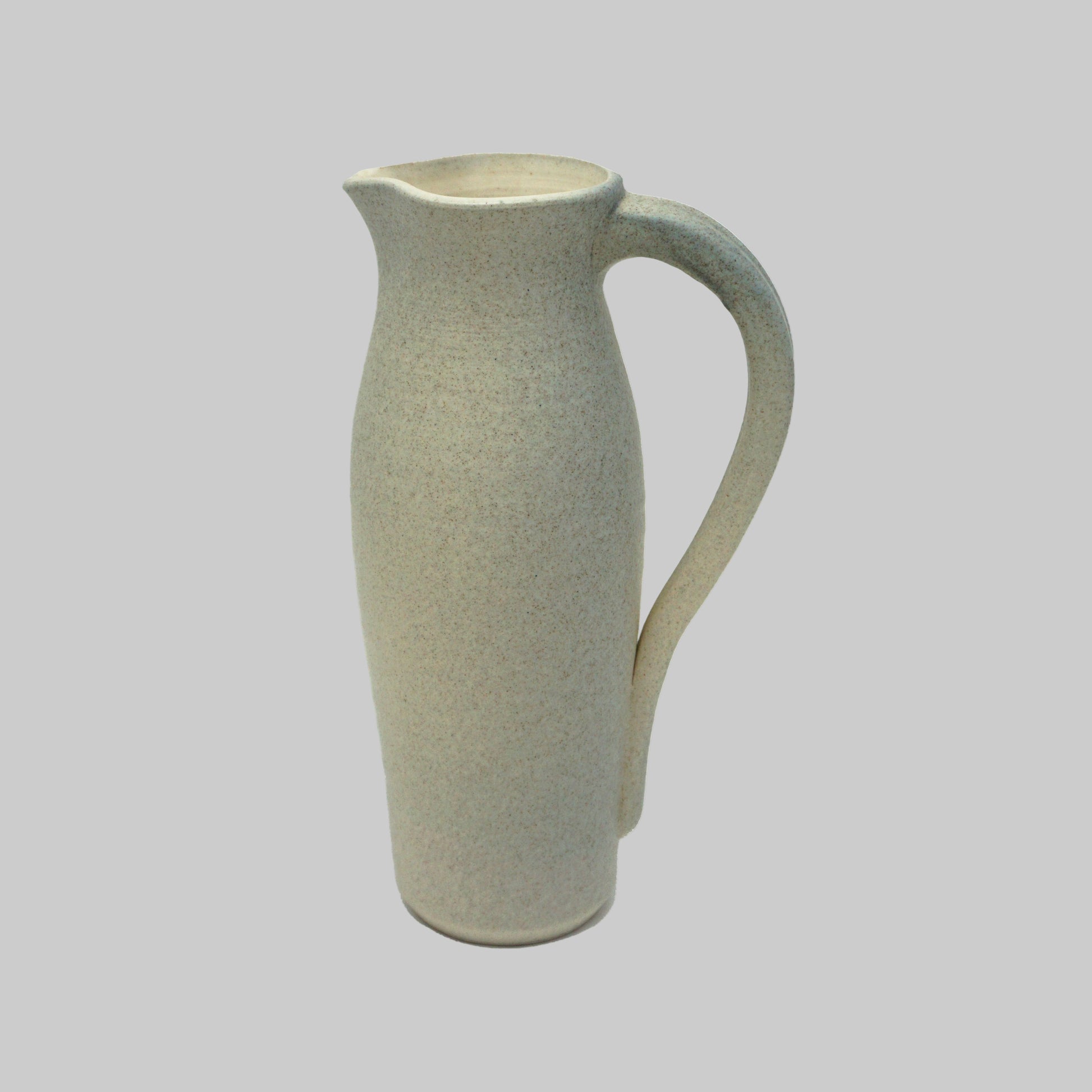 Ceramic grey pitcher with a textured surface on a white background