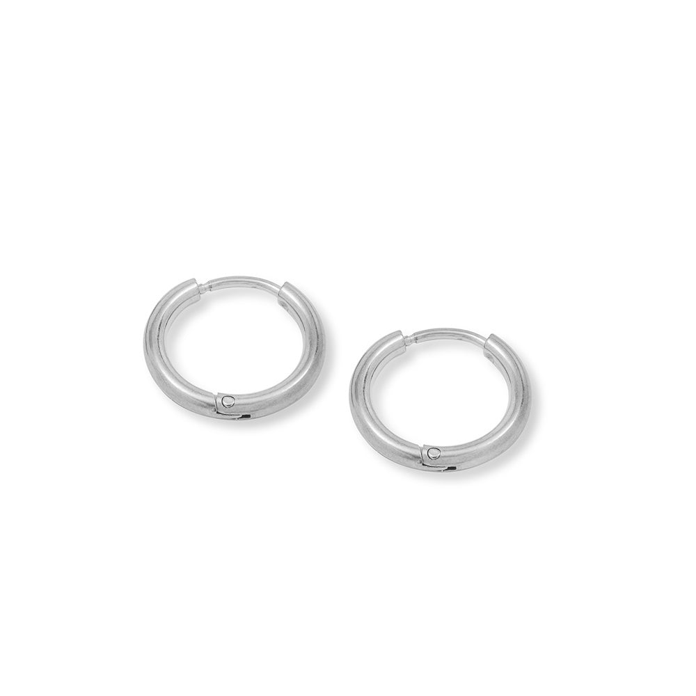 A pair of simple, smooth round silver hoop earrings on a plain white background