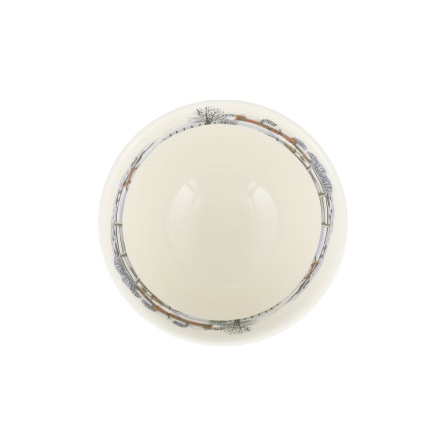 Round white ceramic bowl with an illustrative rim on a white background