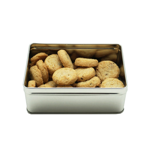 An open metal tin of mini chocolate chip cookies.