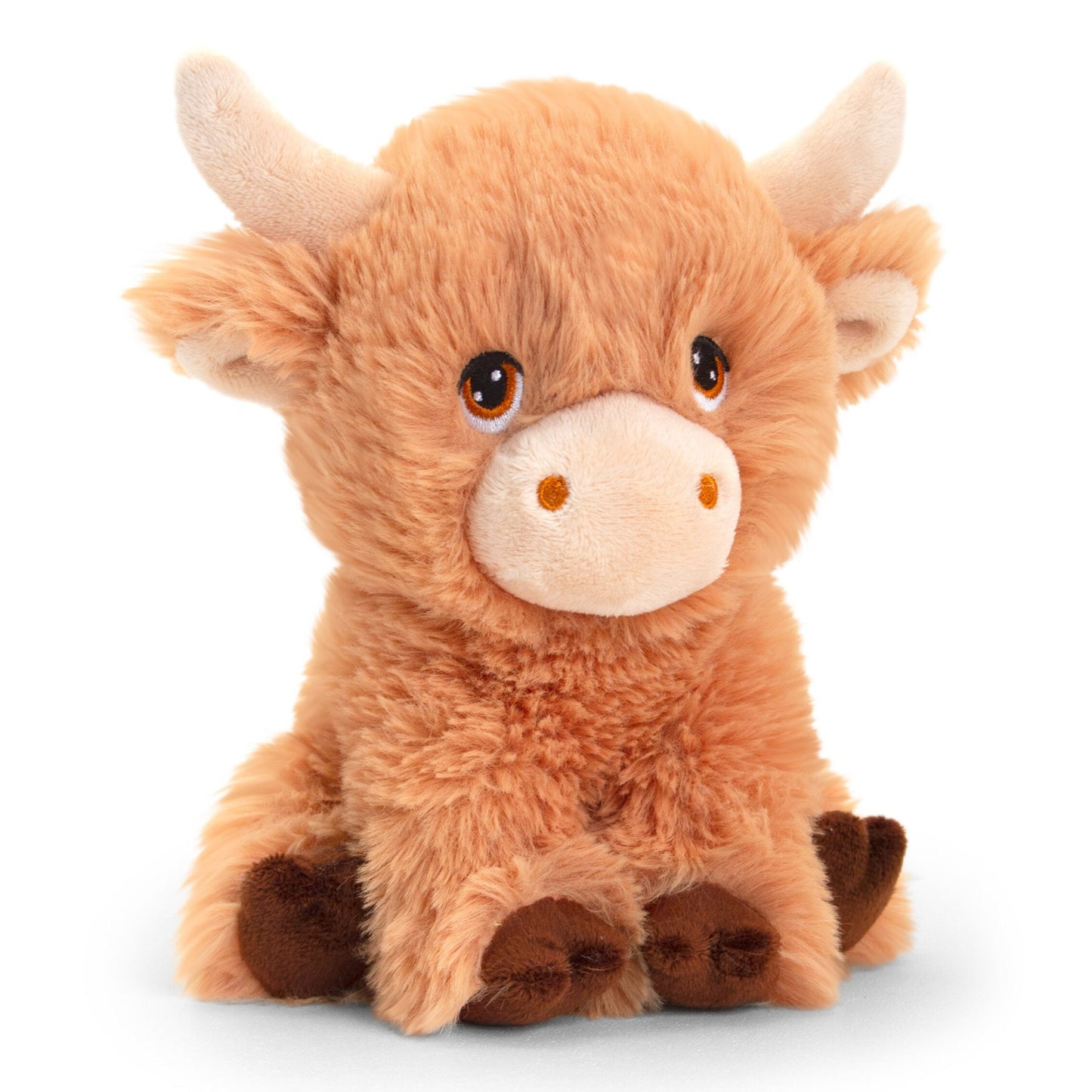 A soft, plush toy resembling a Highland cow. It has a fluffy orange-brown body, small brown hooves, and large, expressive eyes. Its ears are rounded, and it features two small, curved horns on its head, giving it a cute and cuddly appearance.