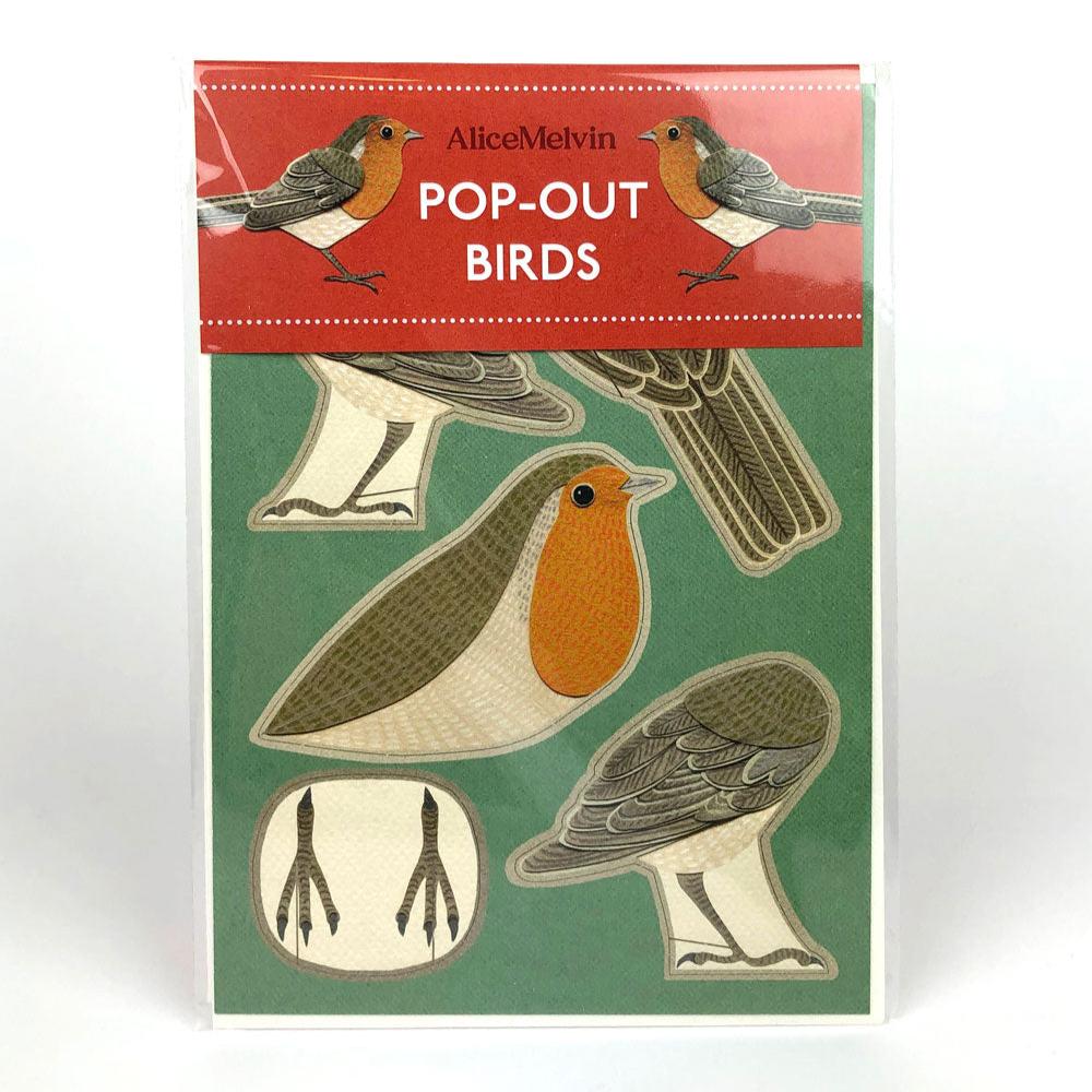 A pack of pop-out bird cutouts by Alice Melvin, featuring various bird illustrations on a green background. The top label reads "POP-OUT BIRDS" in bold letters, with a small bird graphic above. The cutouts include detailed depictions of birds and their features.