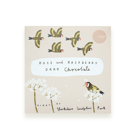 A bar of chocolate in a pink cardboard wrapper that features illustrations of British birds and flowers.