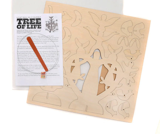Wooden square laser cut unpainted tree of life sheet with instructions on a white background.