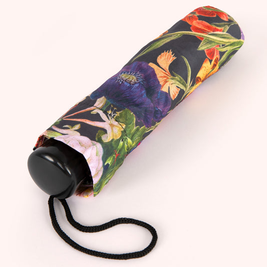 Foldable umbrella with floral pattern on a white background