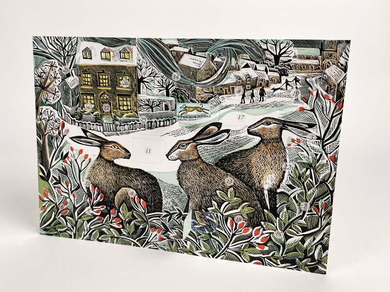 An illustrated advent card depicting three hares in a wintry landscape with holly and berries.