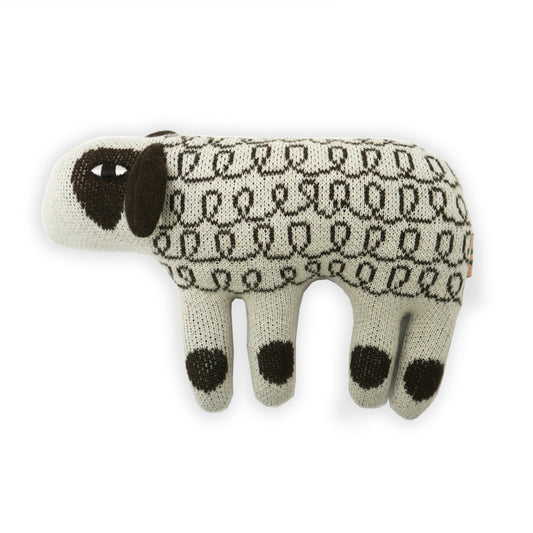 A stylised stuffed cream and brown soft toy sheep with a patterned body and big brown ears.