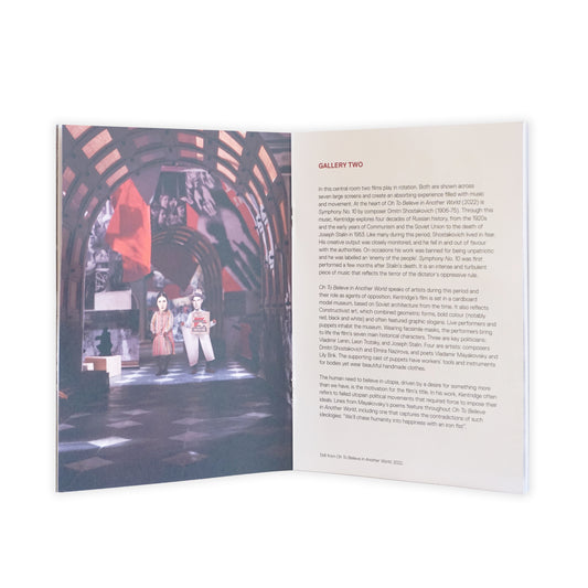 Open book with a photograph on the left and text on the right, set against a white background.