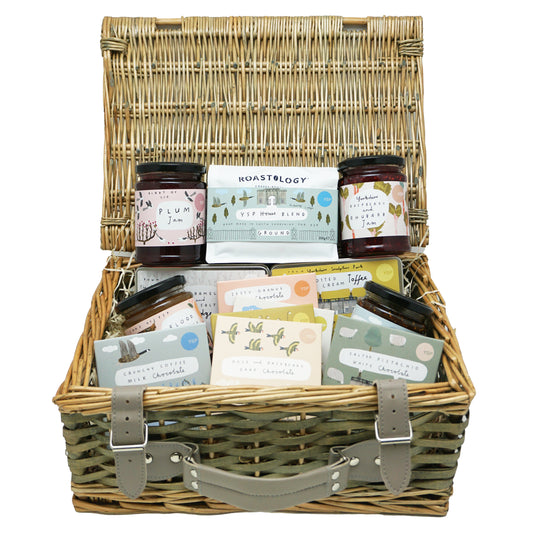 Yorkshire Sculpture Park gift food hamper in a wicker basket with thirteen Yorkshire made food and drink products inside.