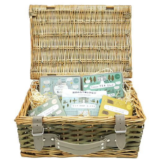 A Yorkshire made produce hamper in a wicker basket with five products in.