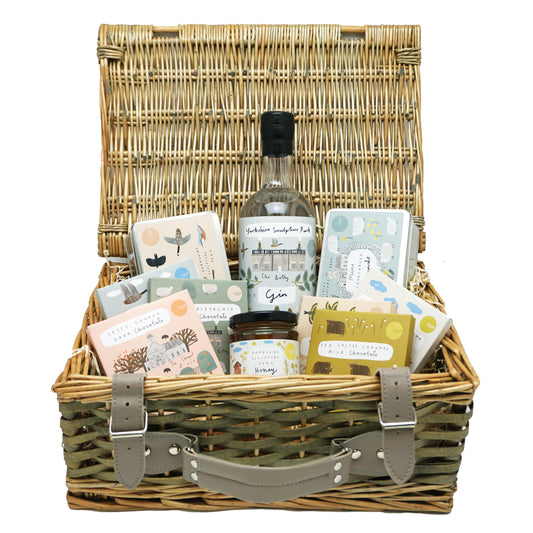 Yorkshire Sculpture Park gift food hamper in a wicker basket with ten Yorkshire made food and drink products inside.