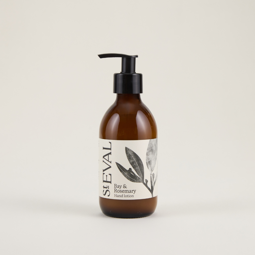 Brown bottle with pump and white label on a beige background