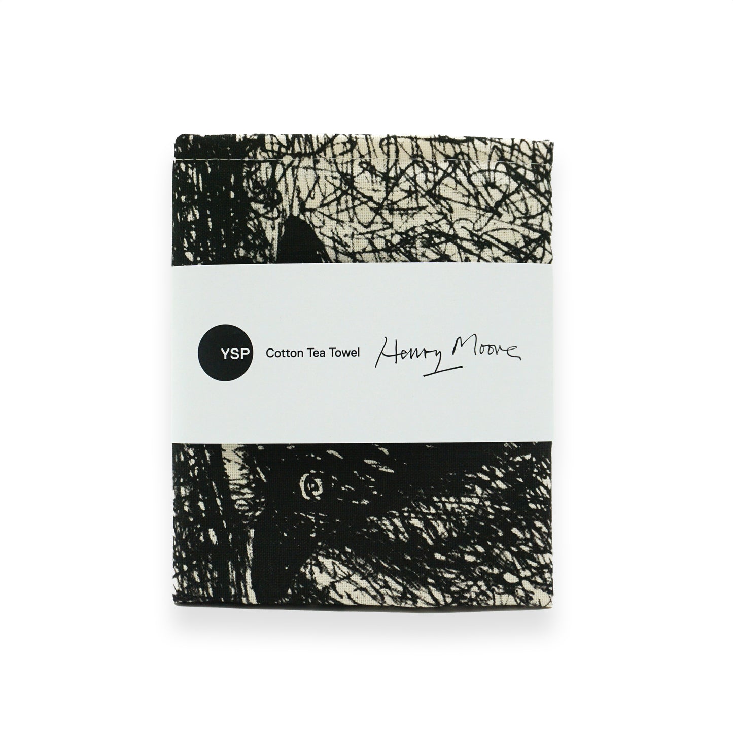 A folded cotton tea towel featuring a black and white artistic design. The towel is wrapped with a label that reads "YSP Cotton Tea Towel" and "Henry Moore," showcasing a signature and the brand's logo.