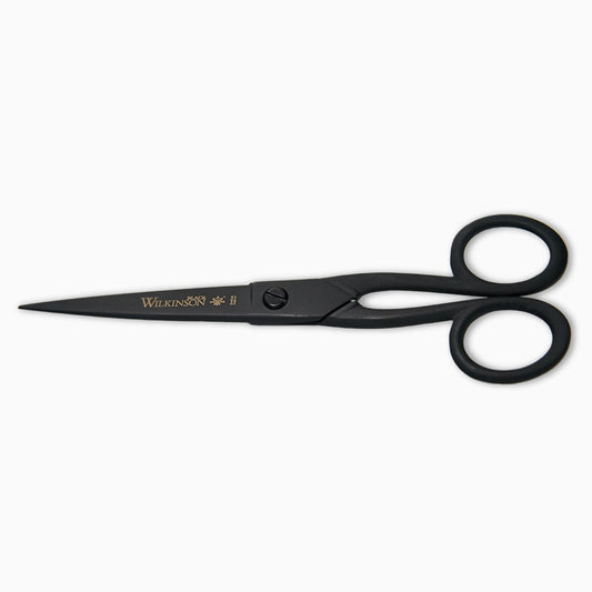 A pair of black scissors with a sleek design, featuring a pointed tip and rounded handles. The brand name "Wilkinson" is elegantly displayed on one of the blades. The scissors are positioned on a plain white background.