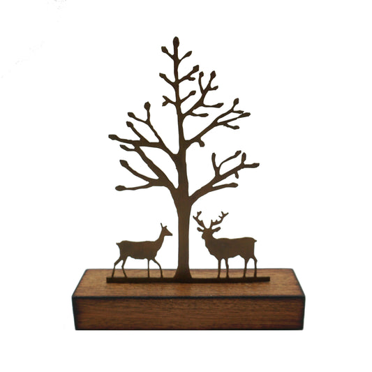 A miniature sculptural artwork by David Mayne featuring a laser cut oxidised steel tree with two deer mounted on a hardwood timber block.