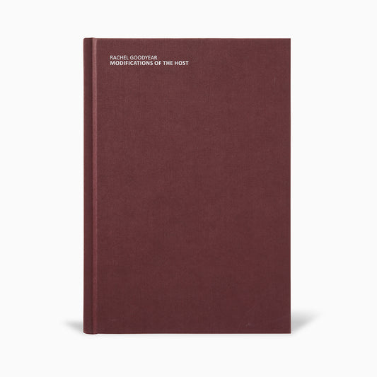 A plain burgundy hardcover book titled "Modifications of the Host" by Rachel Goodyear. The title and author's name are embossed in white on the front cover, with a minimalist design and no additional images or text.
