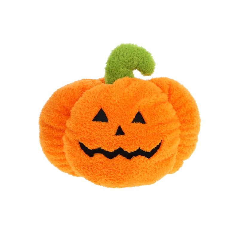 Plush orange pumpkin toy with a smiling face and black eyes on a white background. The pumpkin has a green stalk coming out the top and appears to be in fluffy material. 