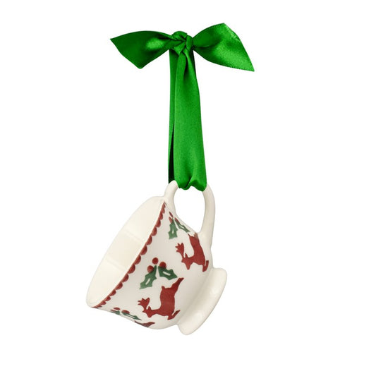 Decorative mug with reindeer design and green ribbon on a white background
