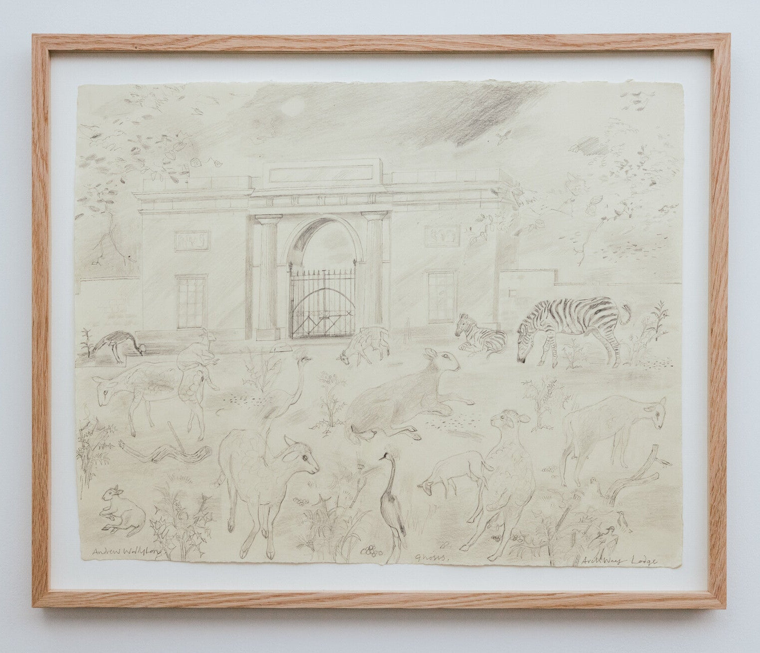 Framed black and white drawing of animals on a plain wall