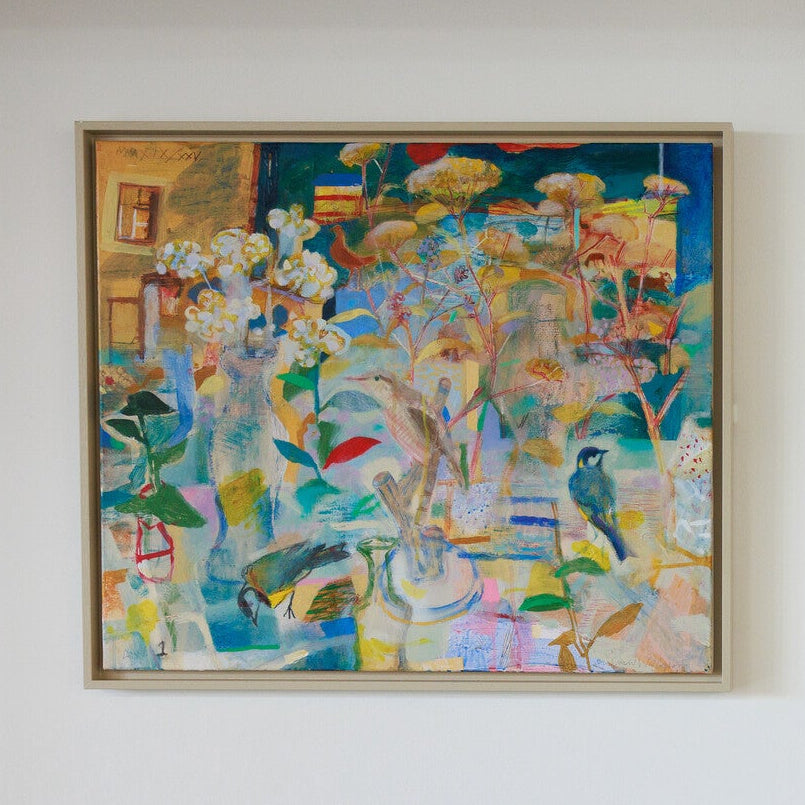 Three colorful abstract paintings on a white wall