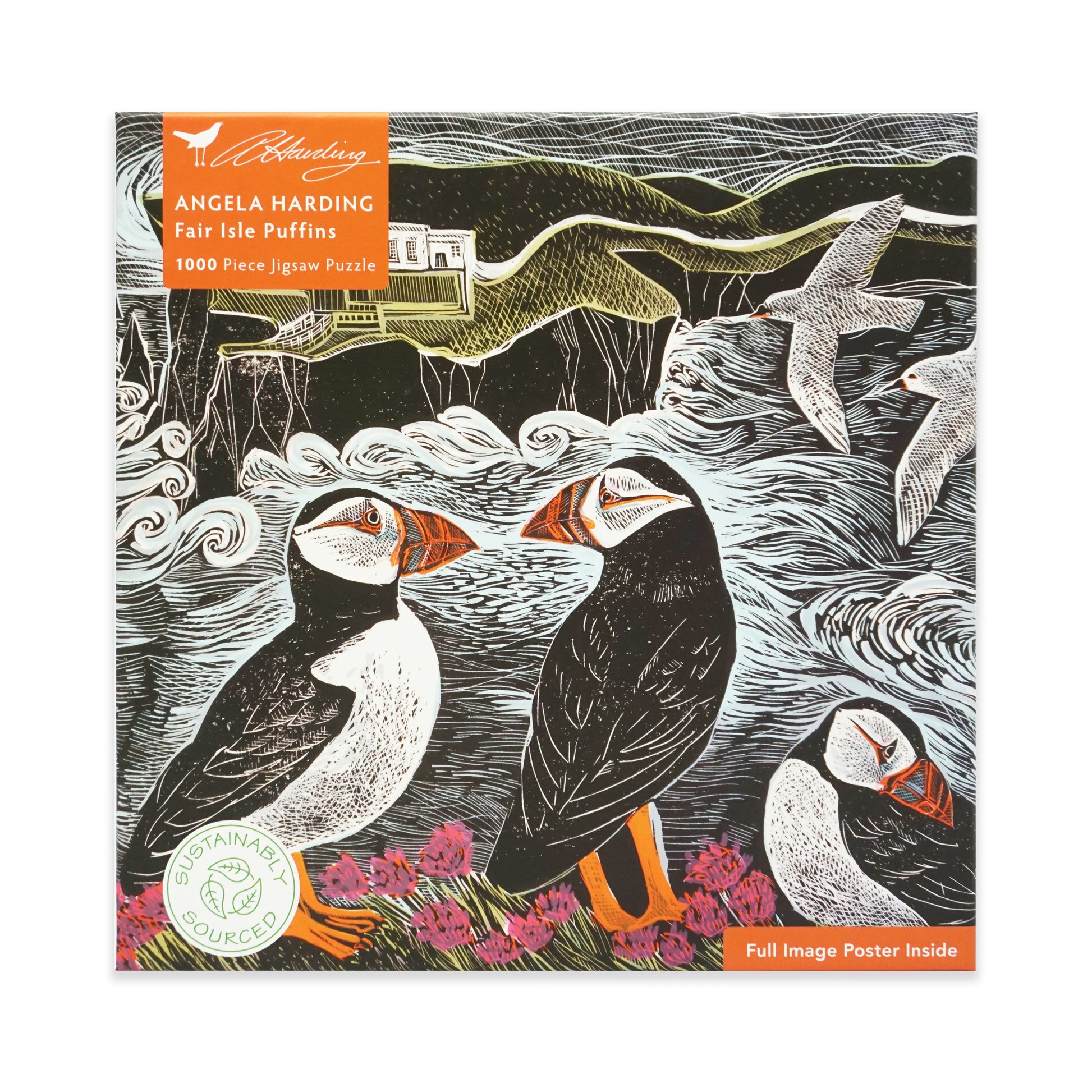 Jigsaw puzzle packaging with puffins and a scenic design with a lighthouse in the distance, featuring the brand 'Angela Harding'. The main colours are black, white, orange, purple and green.