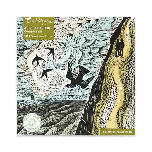 Jigsaw puzzle box with artistic design of swallows in flight, a cliff and a path, featuring the brand 'Angela Harding'. The main colours are green, blue and black.