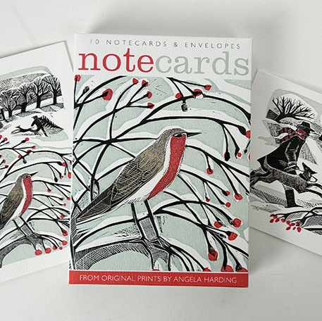 A pack of Christmas notecards designed by print maker Angela Harding. The designs feature wintery birds and the main colours are red, black and white.