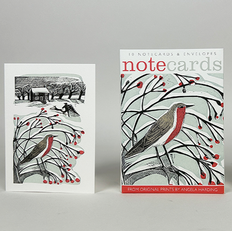 A pack of Christmas notecards designed by print maker Angela Harding. The designs feature wintery birds and the main colours are red, black and white.
