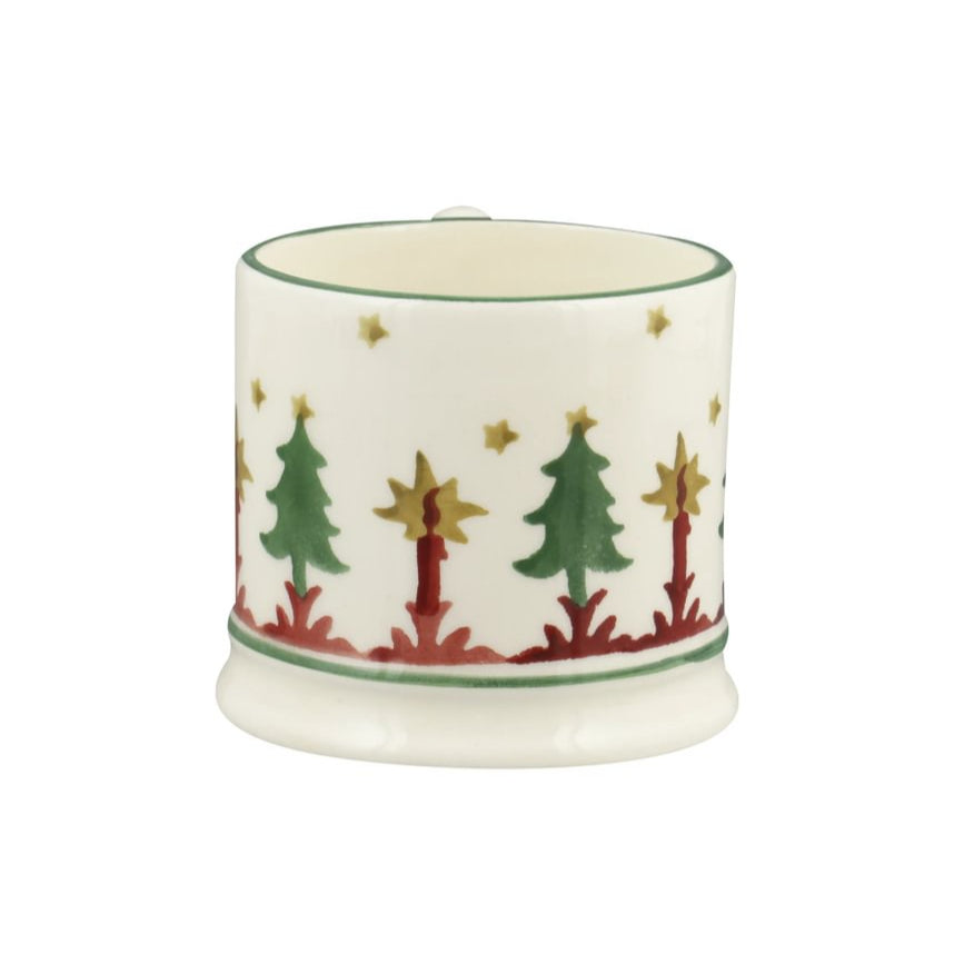 Decorative ceramic mug with Christmas tree design on a white background