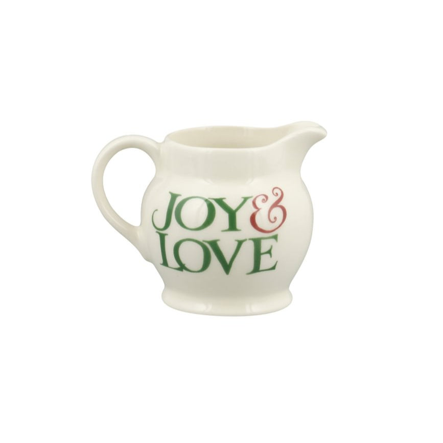 White ceramic pitcher with 'Joy & Love' text on a white background