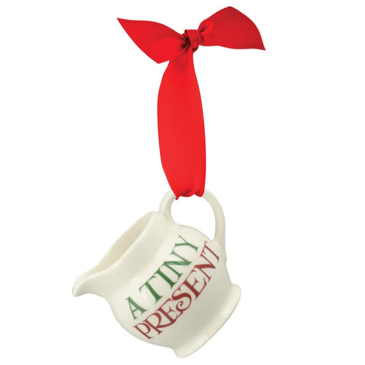 White jug ornament with red ribbon on a white background
