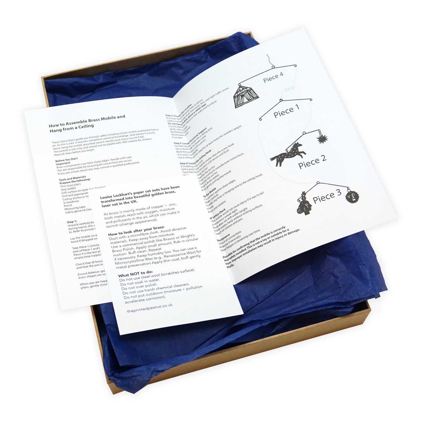 Open box with assembly instructions and piece diagram on a white background