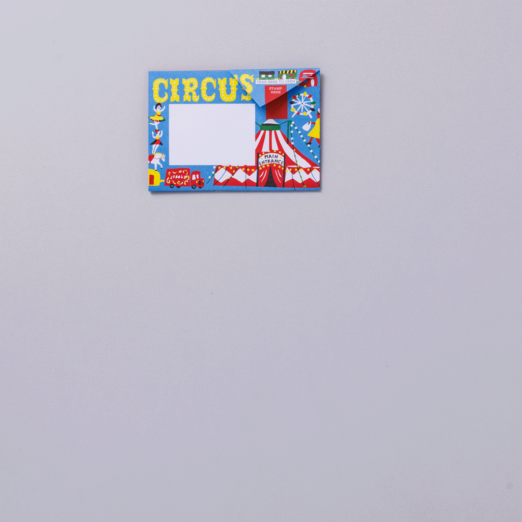 A colourful postcard featuring a circus theme, with illustrations of a big top tent, circus animals, and performers. The word "CIRCUS" is prominently displayed in bright yellow letters at the top, with a blank space for a message.